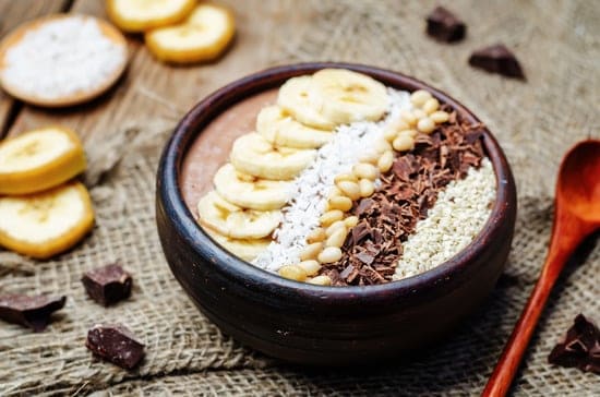 chocolate smoothie with banana, coconut, pine nuts, chocolate and sesame seeds. toning. selective focus